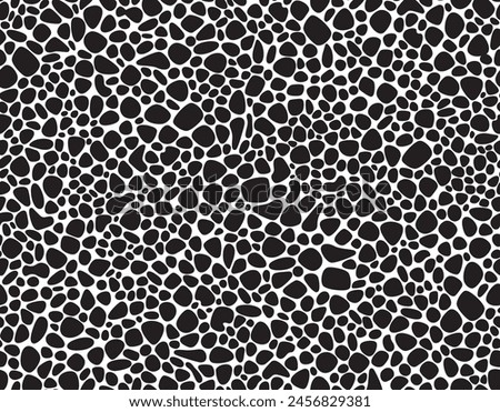 Seamless pattern of black pebbles arranged in a random organic pattern on a white background