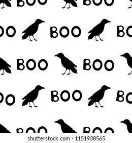 Seamless pattern with black ravens and words Boo on the white background . Vector illustration