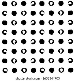 Seamless pattern from black round textured brush strokes on a white background