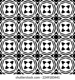 
Seamless pattern of black shapes on white background.