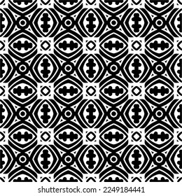 Seamless pattern of black shapes on white background.
