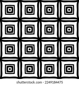 
Seamless pattern of black shapes on white background.