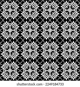 
Seamless pattern of black shapes on white background.