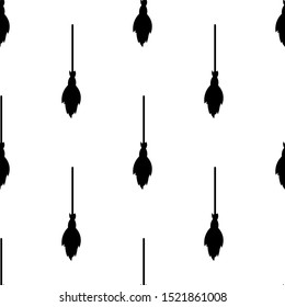 Seamless pattern with black silhouette of broomstick. Halloween texture. Vector illustration for design, web, wrapping paper, fabric.