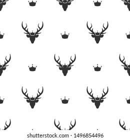 seamless  pattern with black silhouette of deer head with royal crown. vector flat Christmas ornament on white background