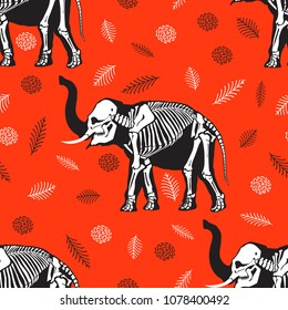 Seamless pattern. Black silhouette of an elephant with a white skeleton among the leaves. X-ray of the elephant. Great for tattoo and printing on a T-shirt. Ideal for decoration of Halloween.
