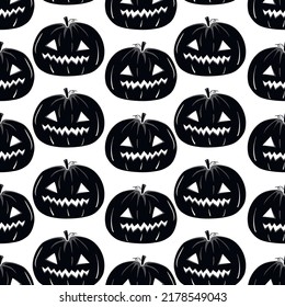 Seamless pattern with black silhouette of a pumpkin face for halloween on a white background.