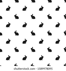 Seamless pattern with black silhouette of sitting rabbit isolated on white background. Vector illustration for wrapping paper, wallpaper, fabric, textile and more.