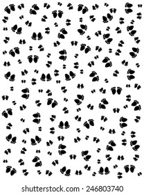 Seamless pattern with black silhouettes of footprints of baby, vector