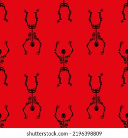 Seamless pattern with black skeletons dancing and having fun on a red background.