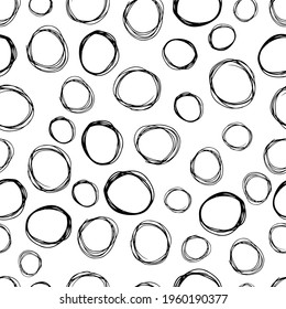 Seamless pattern with black sketch hand drawn brush scribble circles shape on white background. Abstract grunge texture. Vector illustration
