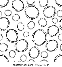 Seamless pattern with black sketch hand drawn brush scribble circles shape on white background. Abstract grunge texture. Vector illustration