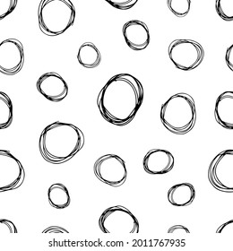 Seamless pattern with black sketch hand drawn brush scribble circles shape on white background. Abstract grunge texture. Vector illustration