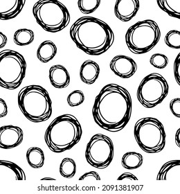Seamless pattern with black sketch hand drawn brush scribble circles shape on white background. Abstract grunge texture. Vector illustration