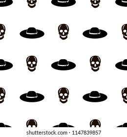 Seamless pattern with black skulls and hats on the white background. Vector illustration