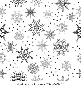 Seamless pattern with black snowflakes on white background for winter design. Christmas and New Year elements. 