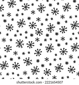 Seamless pattern with black snowflakes on a white background in doodle style.
