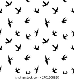 Patrón transparente de golondrinas negras. Silueta negra sobre fondo blanco. Contornos negros de aves voladoras. Tragos voladores. ilustración vectorial aislada en fondo blanco.