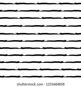 Seamless pattern with black watercolor stripes on white background in grunge style