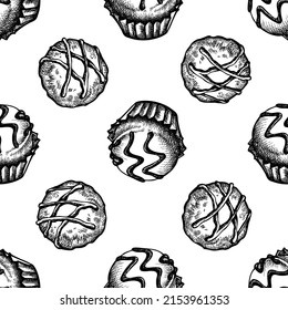 Seamless pattern with black and white chocolate candies