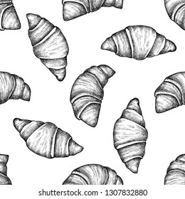 Seamless pattern with black and white croissants and bread