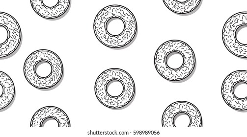 Seamless pattern with black and white glazed donuts and sprinkles