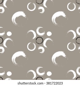 Seamless pattern of black and white grunge circles on a white coffee background