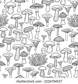 Seamless pattern with black and white mushrooms