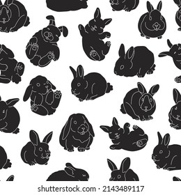 Seamless pattern with black and white rabbits. Symbol of the Chinese zodiac calendar. Cute decorative bunny.  For childish clothes or interior. Minimalistic design. Flat style in vector illustration.