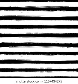 Seamless pattern with black and white striped. Hand drawn black and yellow paint strokes. Grunge style. Hand-drawn stripes, brush strokes, stars. Beautiful vector fashionable floral exotic background.