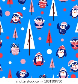 Seamless pattern with blue baby penguins wearing pink, red and white sweaters, hats and scarfs. Blue background. Fir trees. Merry Christmas. Wallpaper, textile, scrapbooking and wrapping paper