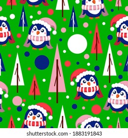 Seamless pattern with blue baby penguins wearing pink, red and white hats and scarfs. Green background. Fir trees and snow. Merry Christmas. Wallpaper, textile, scrapbooking and wrapping paper