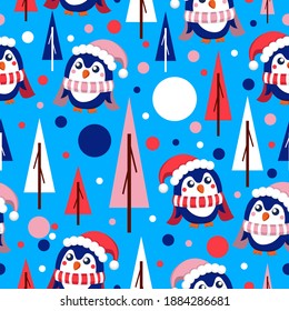 Seamless pattern with blue baby penguins wearing pink, red and white hats and scarfs. Blue background. Fir trees and snow. Merry Christmas. Wallpaper, textile, scrapbooking and wrapping paper