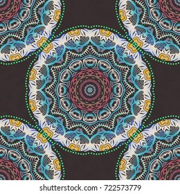 Seamless pattern of blue, beige and green textured curls. Oriental style arabesques on black backdrop. Vector brilliant lace, stylized flowers, paisley. Openwork weaving delicate, abstract background.
