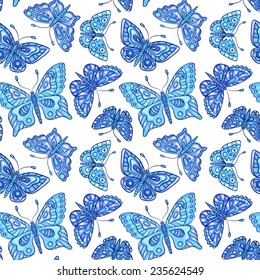 Seamless pattern with blue butterflies. Vector background.