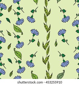 Seamless pattern of blue flowers on a green background. Cornflower meadow.