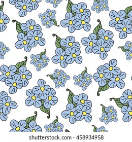 Seamless pattern of blue flowers on a green background. Cornflower meadow.