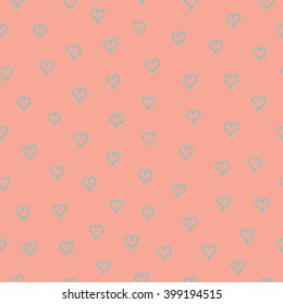 Seamless pattern with blue hearts on pink background.