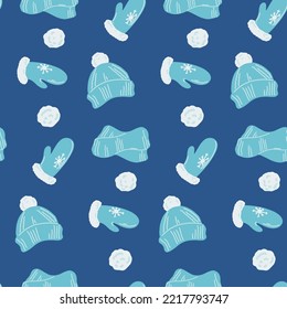 Patrón sin foco con mitones azules y sombrero con pompón. Fondo festivo para el embalaje, tejidos y cualquier diseño. Ilustración vectorial en un estilo plano.