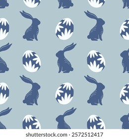 Seamless pattern with blue rabbits and decorative Easter eggs on a light blue background. Spring and Easter celebration design.