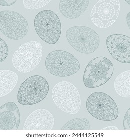 Seamless pattern of blue silhouette Easter eggs with floral patterns, mandala, flowers. Hand drawn spring ornate illustration at Easter greeting card, wallpaper, wrapping paper, fabric, textile