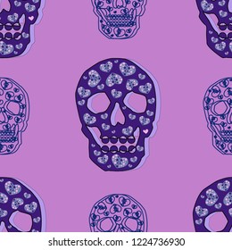 Seamless pattern of blue skulls on a pink background