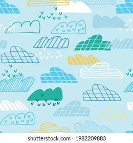 Seamless pattern with blue sky, geometric clouds, rain in cartoon style. Wallpaper, backgound for kids. Perfect for baby, toddler clothing, bed linen