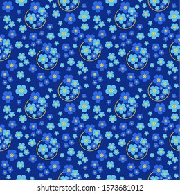 Seamless pattern of blue small forget-me-not flowers on a dark blue background .Vector graphic. 