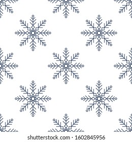 Seamless pattern with blue snowflakes