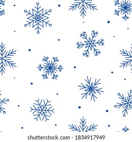 Seamless pattern with blue snowflakes isolated on white - natural background for Christmas and New Year winter design