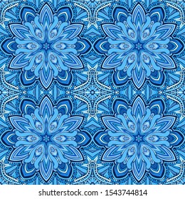 Seamless pattern. Blue snowflakes on an openwork background. Checkered structure.