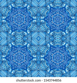 Seamless pattern. Blue snowflakes on an openwork background. Checkered structure.