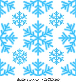 Seamless pattern of blue snowflakes on a white background 
