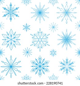 Seamless pattern of blue snowflakes on a white background